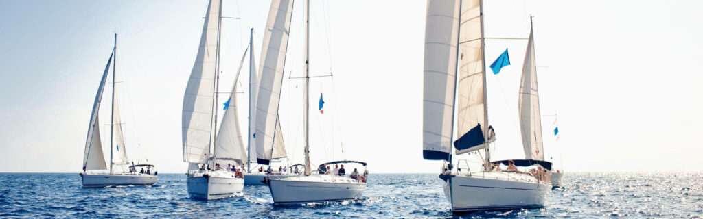 Sailing,Ship,Yachts,With,White,Sails,In,A,Row