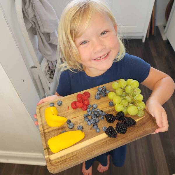 Training starts young - teaching her daughter Nixie to make charcuterie boards