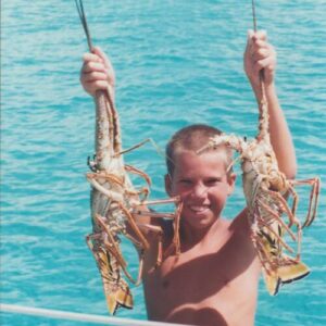 Derk catching lobster in the bahamas - St Augustine Sailing - Sailboat living