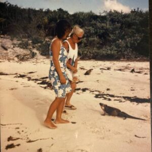 June feeding the iguanas - Bahamas - Sailboat Living