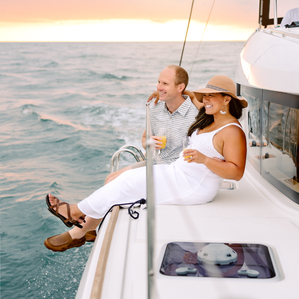 Couple or Family sailing along St. Augustine Historic bayfront on a private charter on a sunset cruise on luxury boat