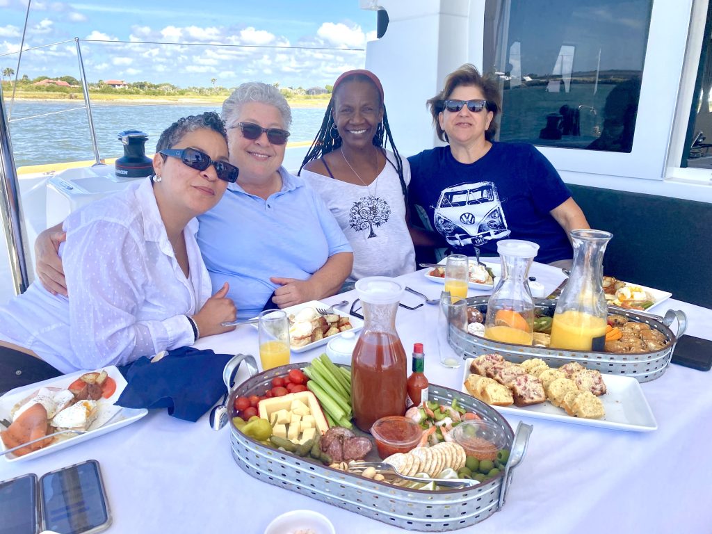 Family Style Brunch Friends and family couple catamaran sailing